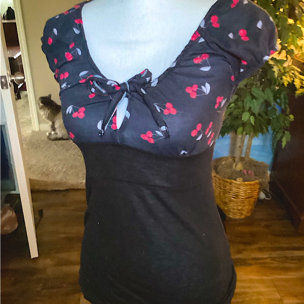 Cherry short sleeved shirt with front tie. Size small